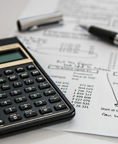 calculator and papers. apply lessons from economics for your daily life
