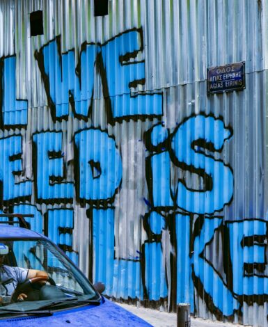 Graffiti reads: All we need is more likes. Social media misinformation spreads rapidly.