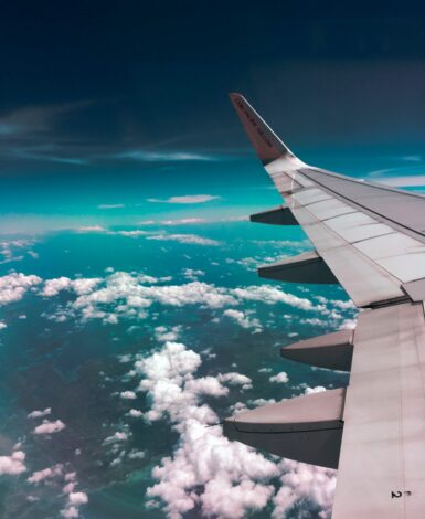 View of the airplane wing. It is no secret that airlines sell tickets for the same flight at different prices. This is a pricing strategy called price discrimination.